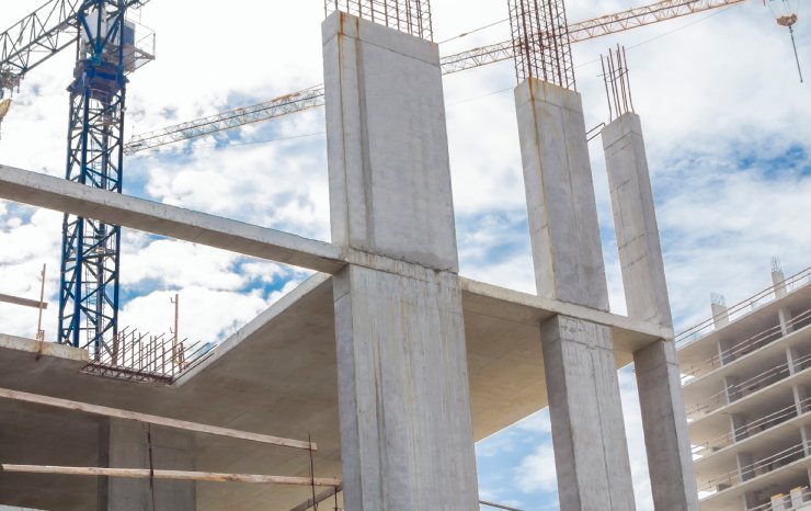 Frame of a house under construction made of concrete slabs.
